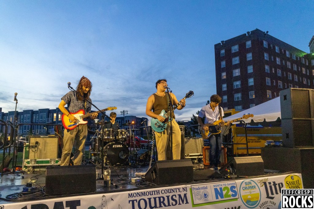 Spyne! performing on stage in Monmouth County.