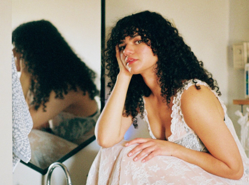 Annelise Gonzalez posting in front of a mirror.