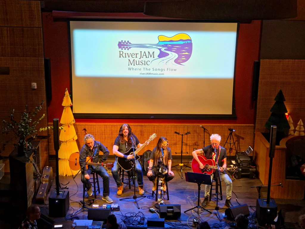 Williams Honor, James Maddock, and Ricky Byrd performing at RiverJAM Music's Songs & Stories concert.