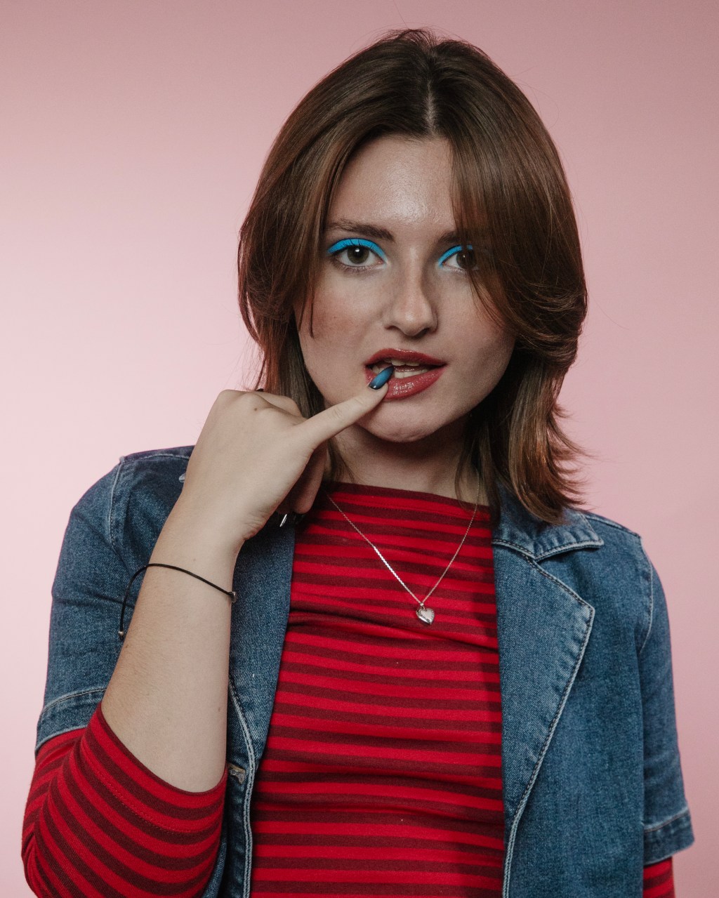 Kenna Heim of Blush Boy in front of a pink background