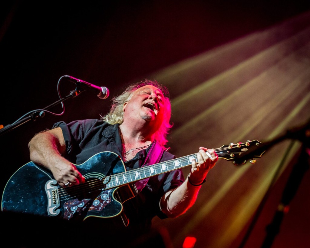 Pat Guadagno on stage with his guitar