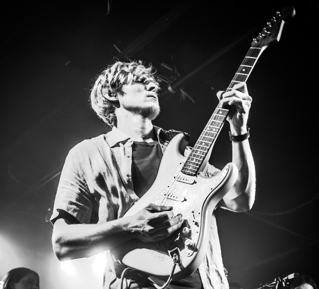 Johnny Kasun holding a guitar