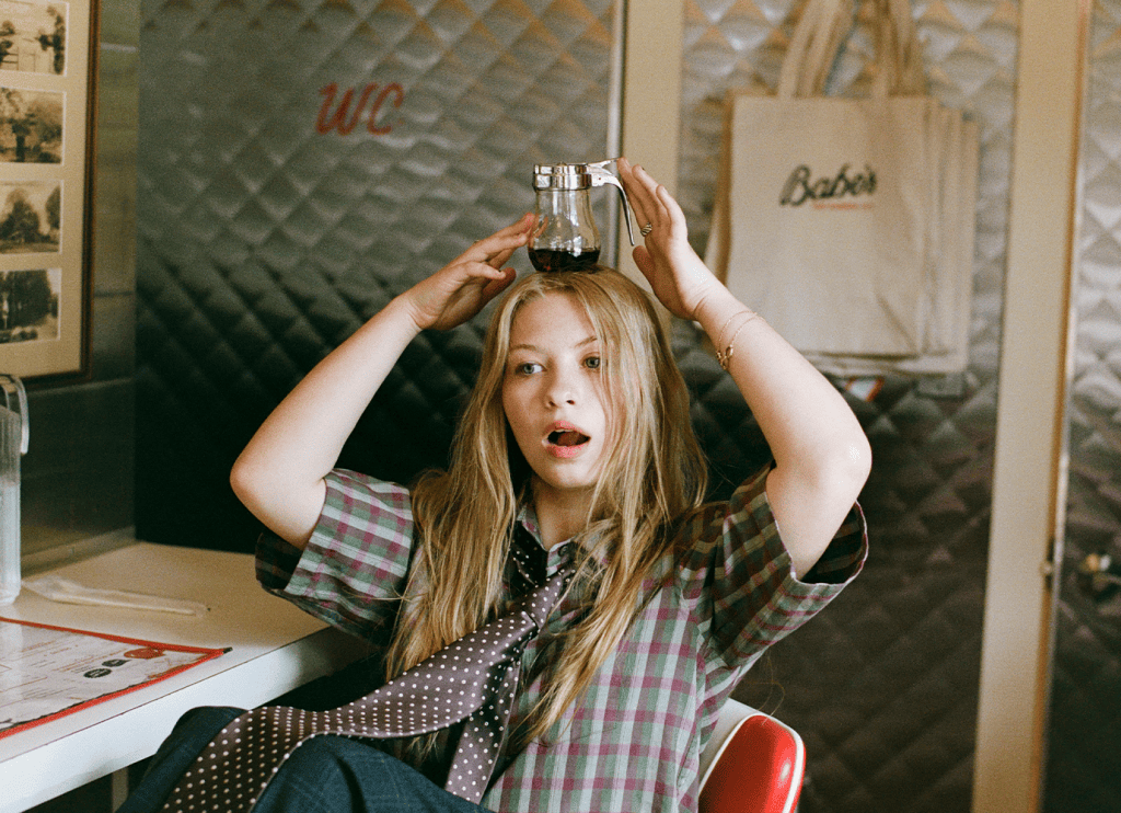 Blythe Woods balancing a cup on her head
